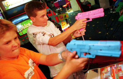 boys playing shooter video game