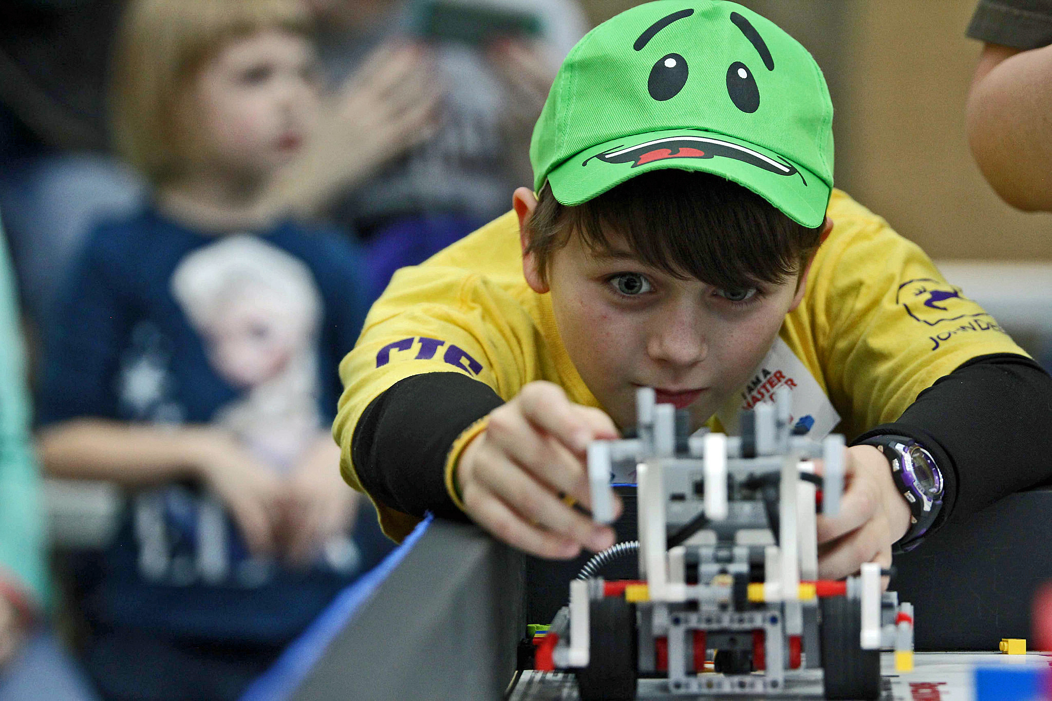 boy competing in lego league