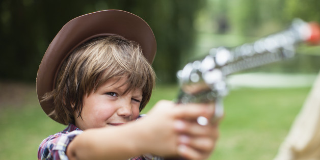 boy with toy pistol