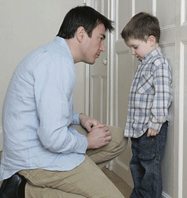 dad talking to little boy