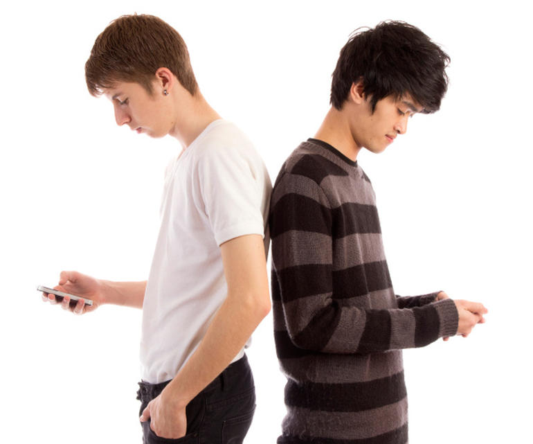 teen boys with smartphones