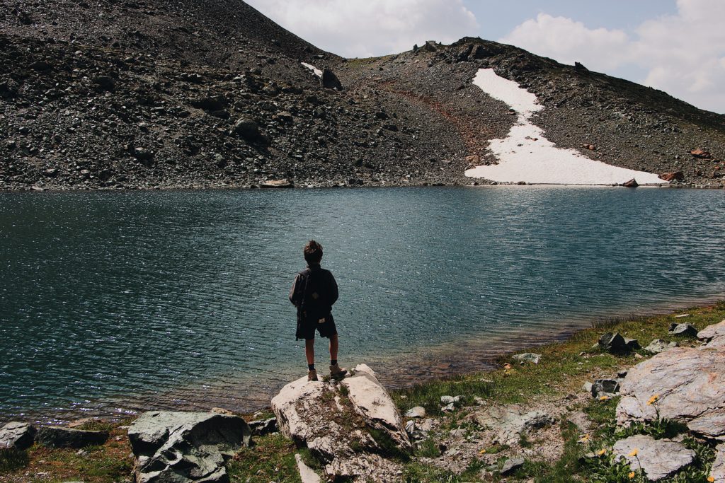 image of brave boy on bank of river sound